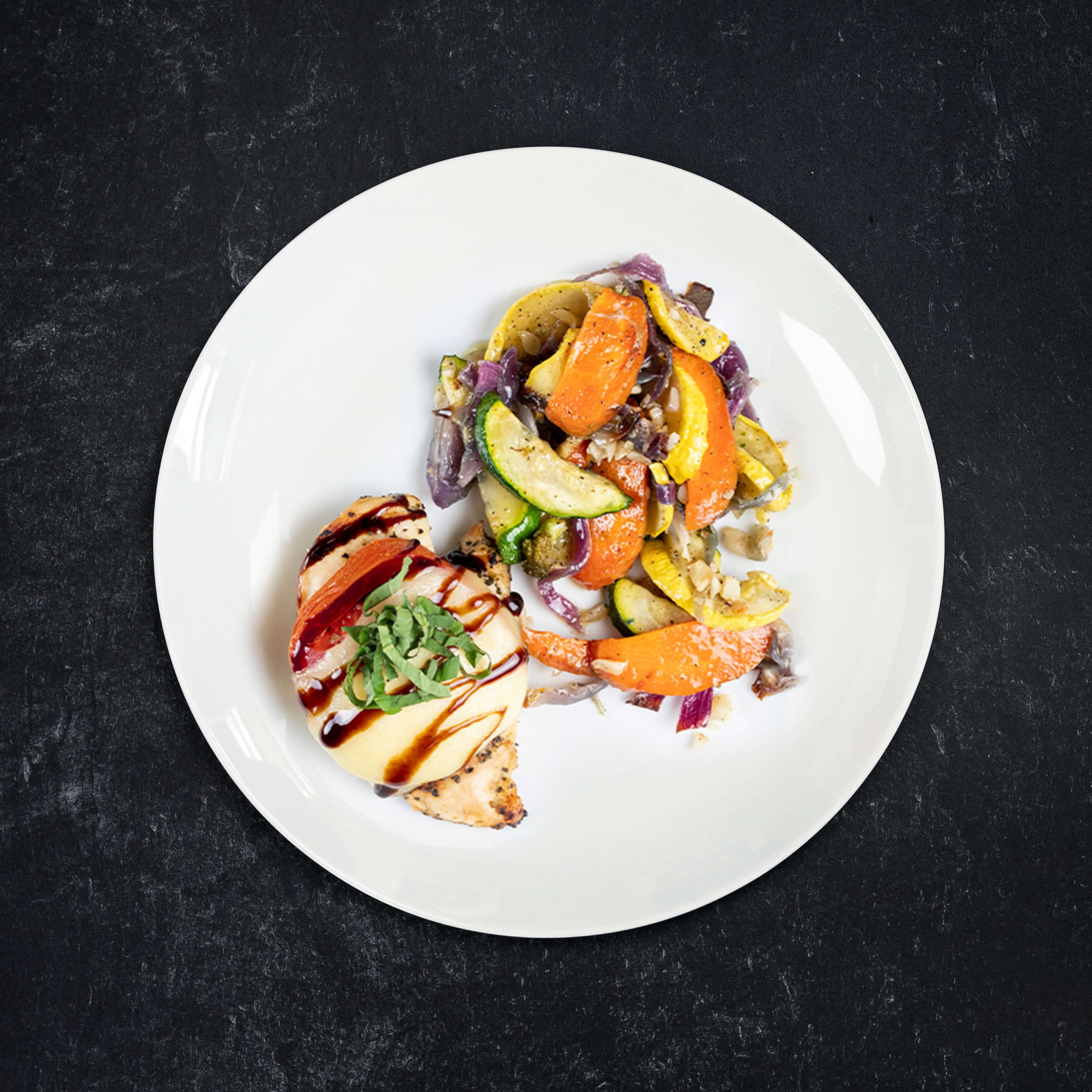 Free-Range Chicken Caprese with Roasted Veggie Medley